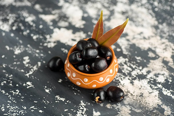 pngtree-jambolan-plum-on-stone-background-green-tropical-jambhul-photo-photo-image_28861884